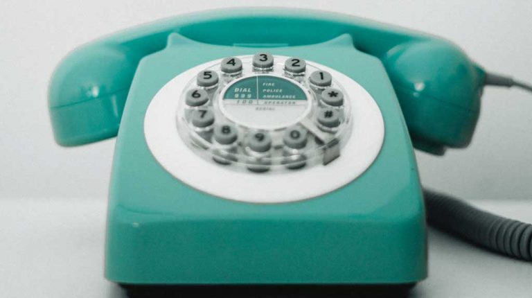 teal rotary-style phone