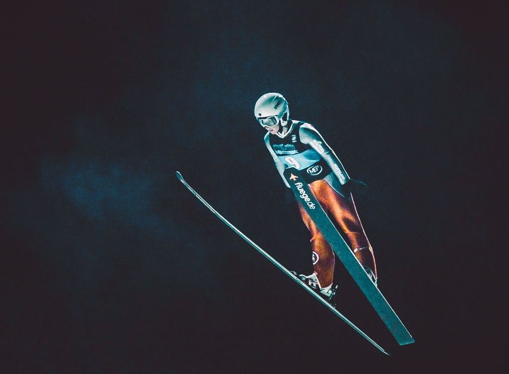 A skier flies through the air.