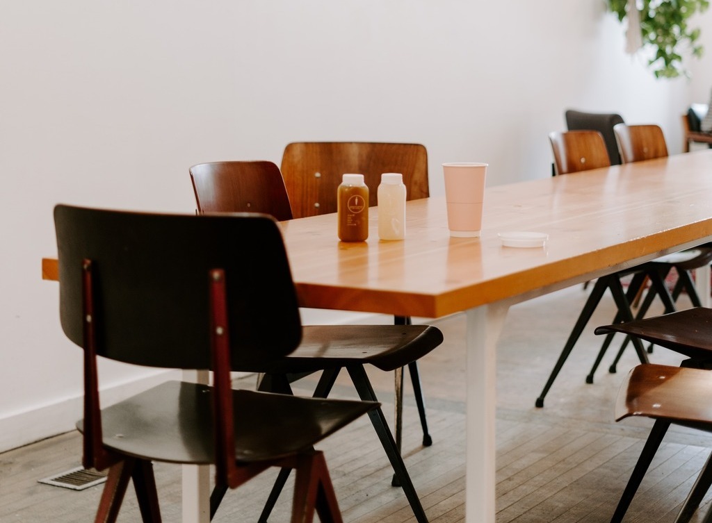 Several office chairs are arranged around a table.