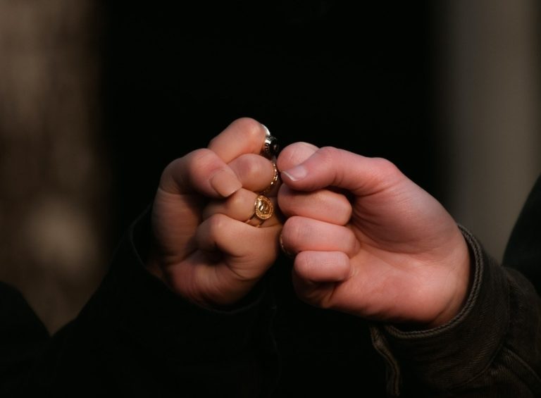 Two fists are shown bumping together.