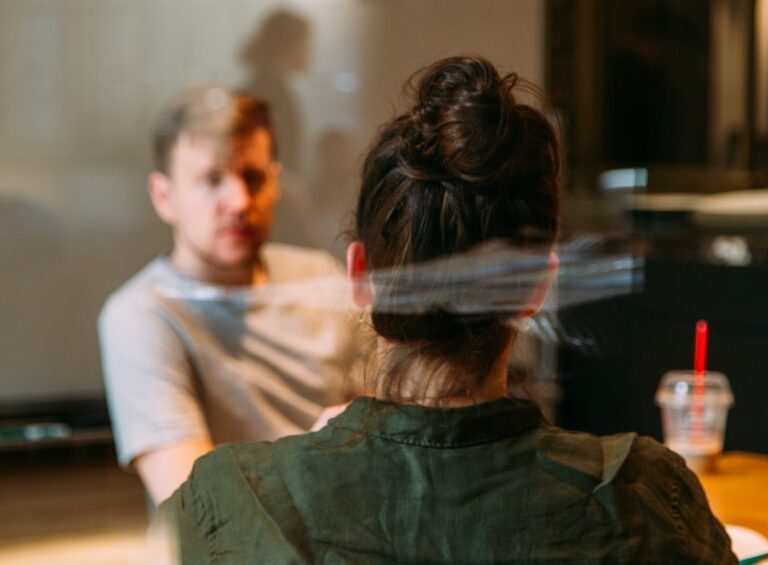 A man and a woman engaged in conversation.