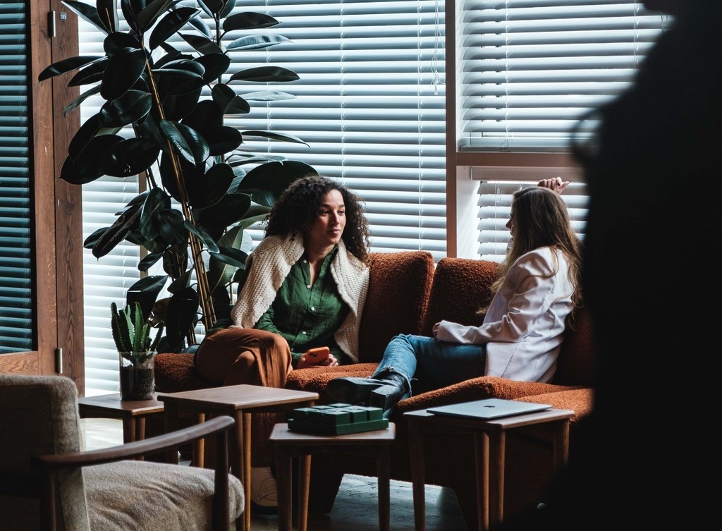 Two women chatting.